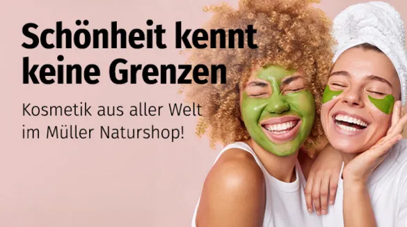 zwei Frauen, grüne Masken aufgetragen, lachend