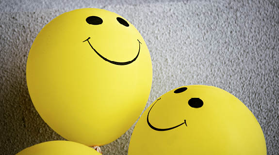 Luftballons mit lachenden Gesichtern